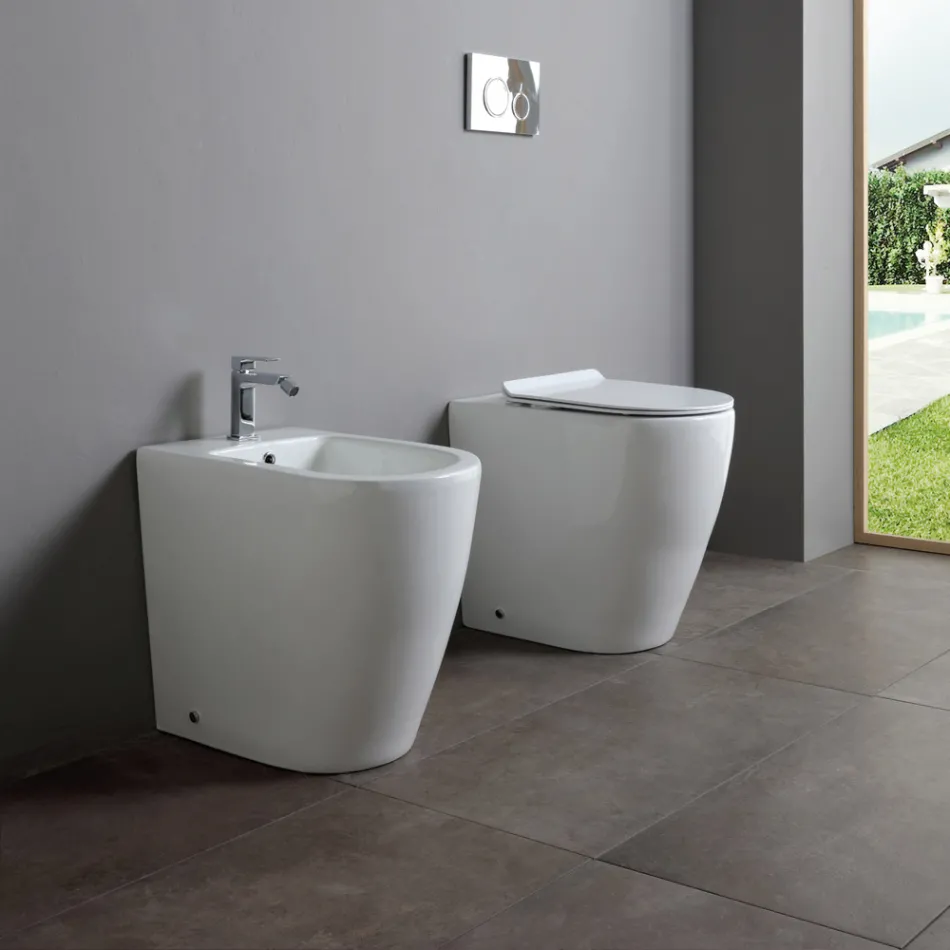 Enkelthulsbidet med forskudt afløb i keramik med et moderne design - Oleandro  Viadurini