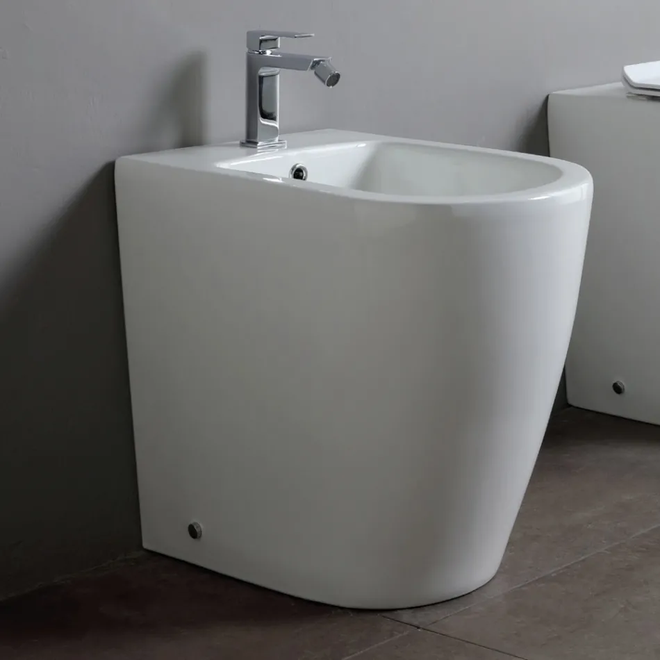 Enkelthulsbidet med forskudt afløb i keramik med et moderne design - Oleandro  Viadurini