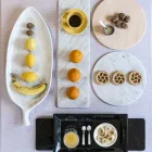 Rund osteplade i hvid eller sort marmor fremstillet i Italien - Kirby Viadurini