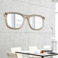 Vægmonteret møbelspejl i form af hånddekorerede briller