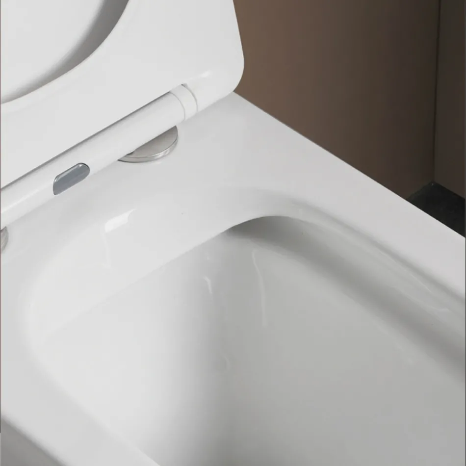 Gulvmonteret toilet med soft-close keramisk sæde og moderne design - Giunco Viadurini