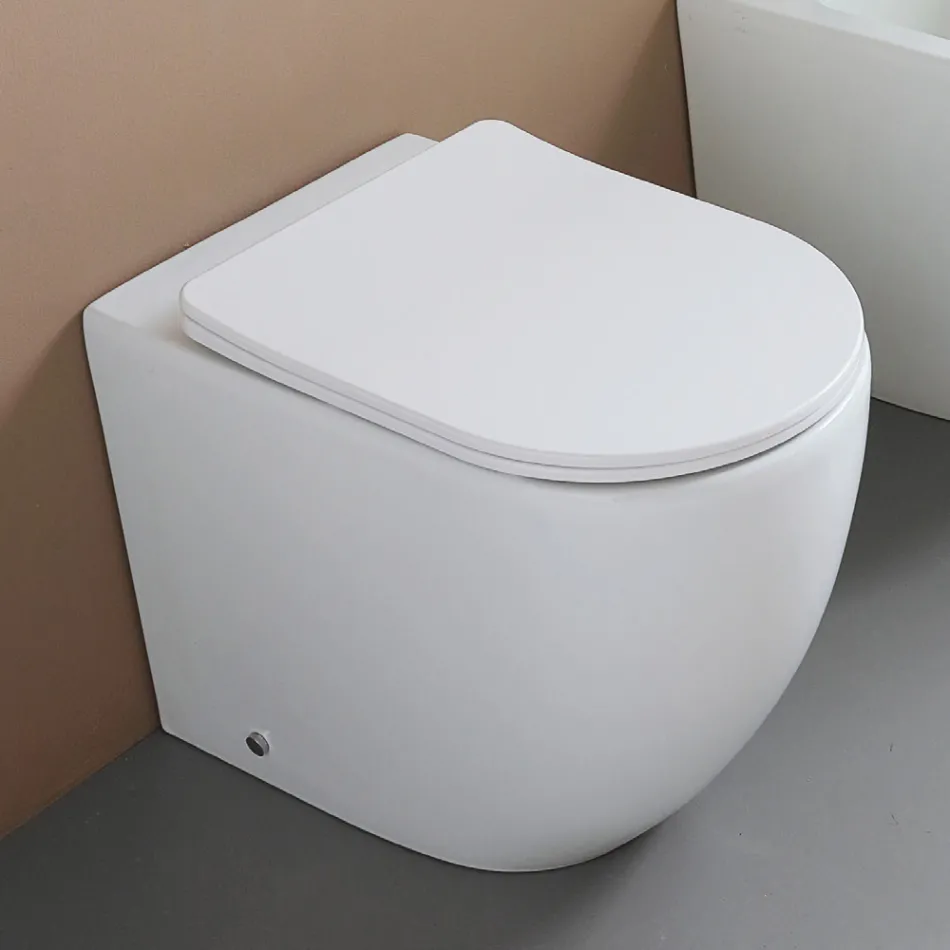 Gulvmonteret toilet med soft-close sæde i hvid keramik - Elm Viadurini