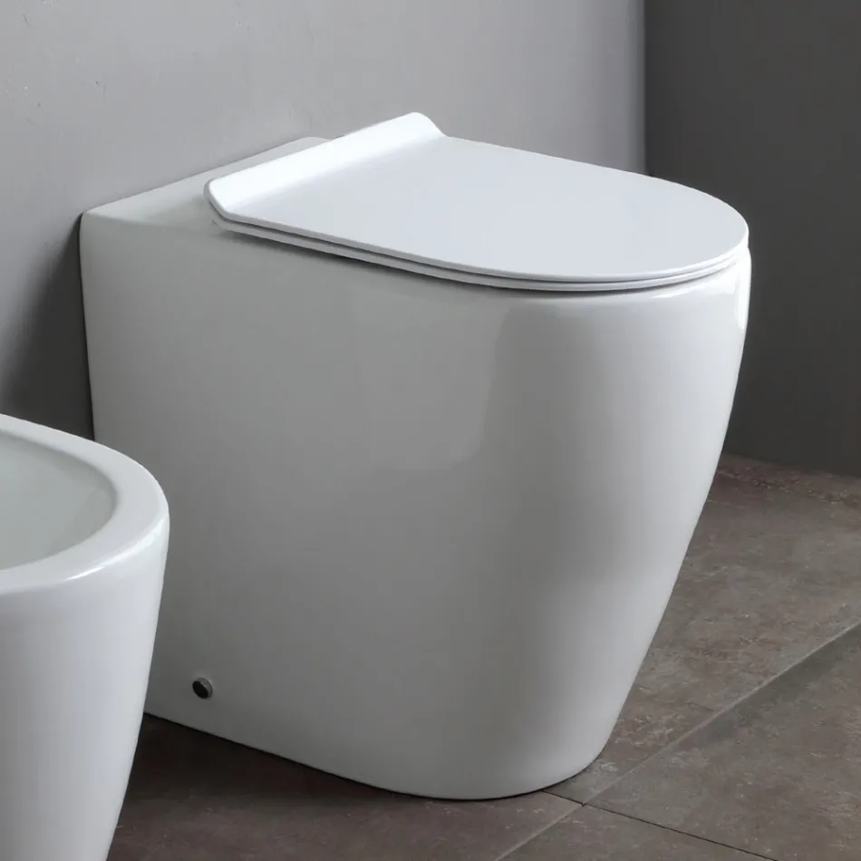 Toilet uden kant med blødt lukkende termohærdende keramisk sæde - Oleander Viadurini
